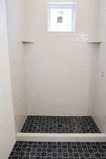 Full bath featuring a stall shower