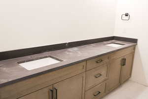 Full bath featuring double vanity