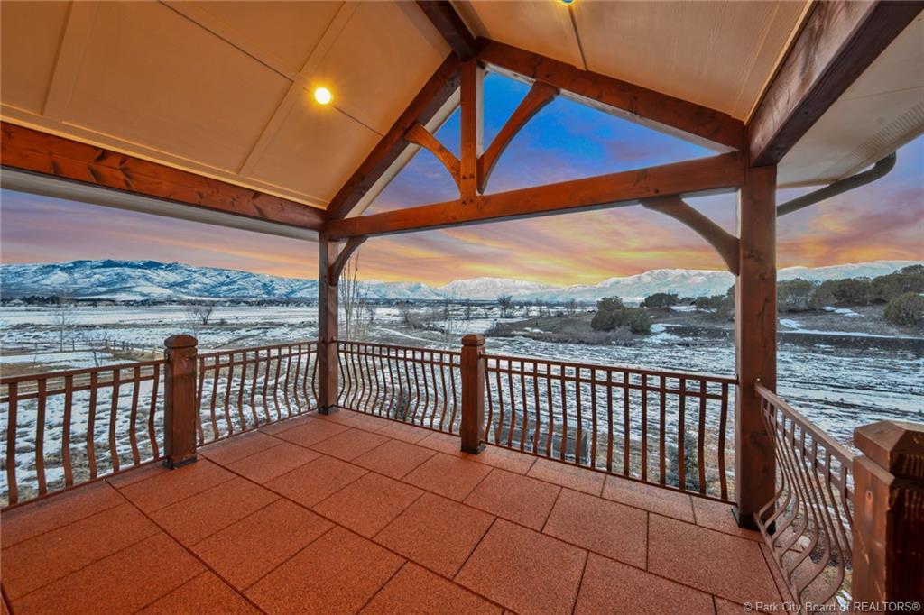 View of property's community featuring a mountain view and a patio