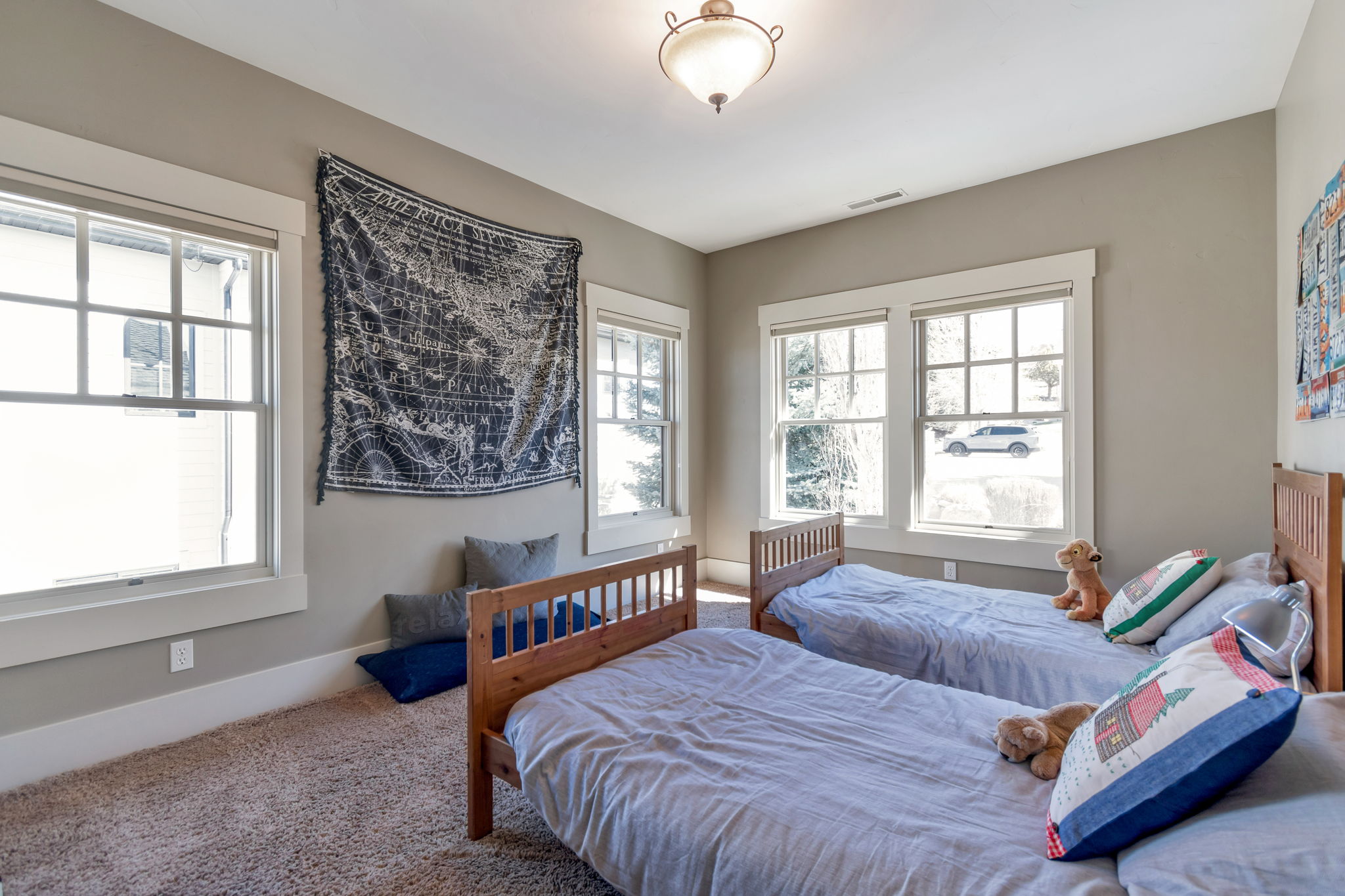 Bedroom featuring carpet flooring and multiple windows