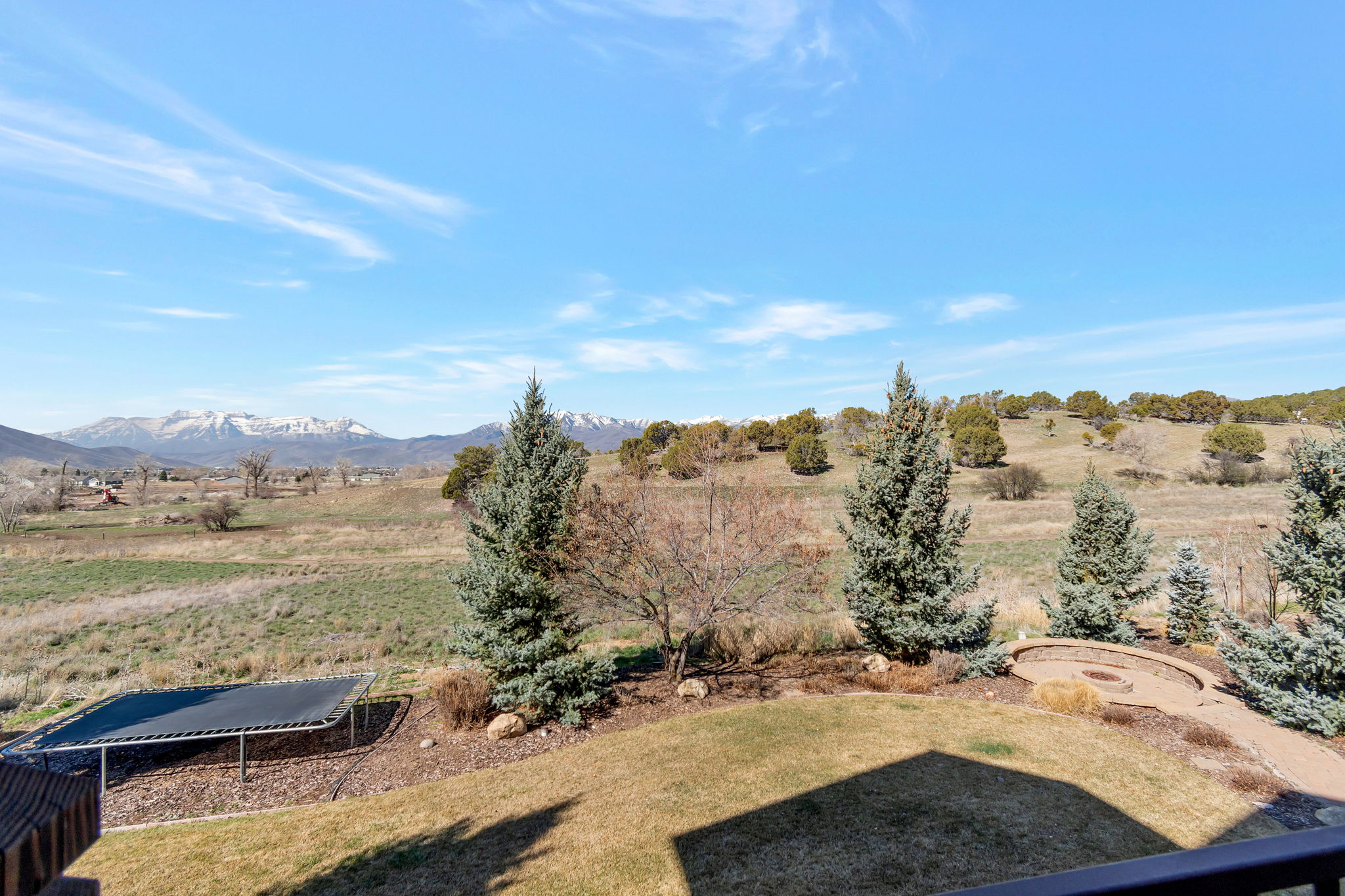 View of grassy yard featuring a view of rural / pastoral area and a mountain view