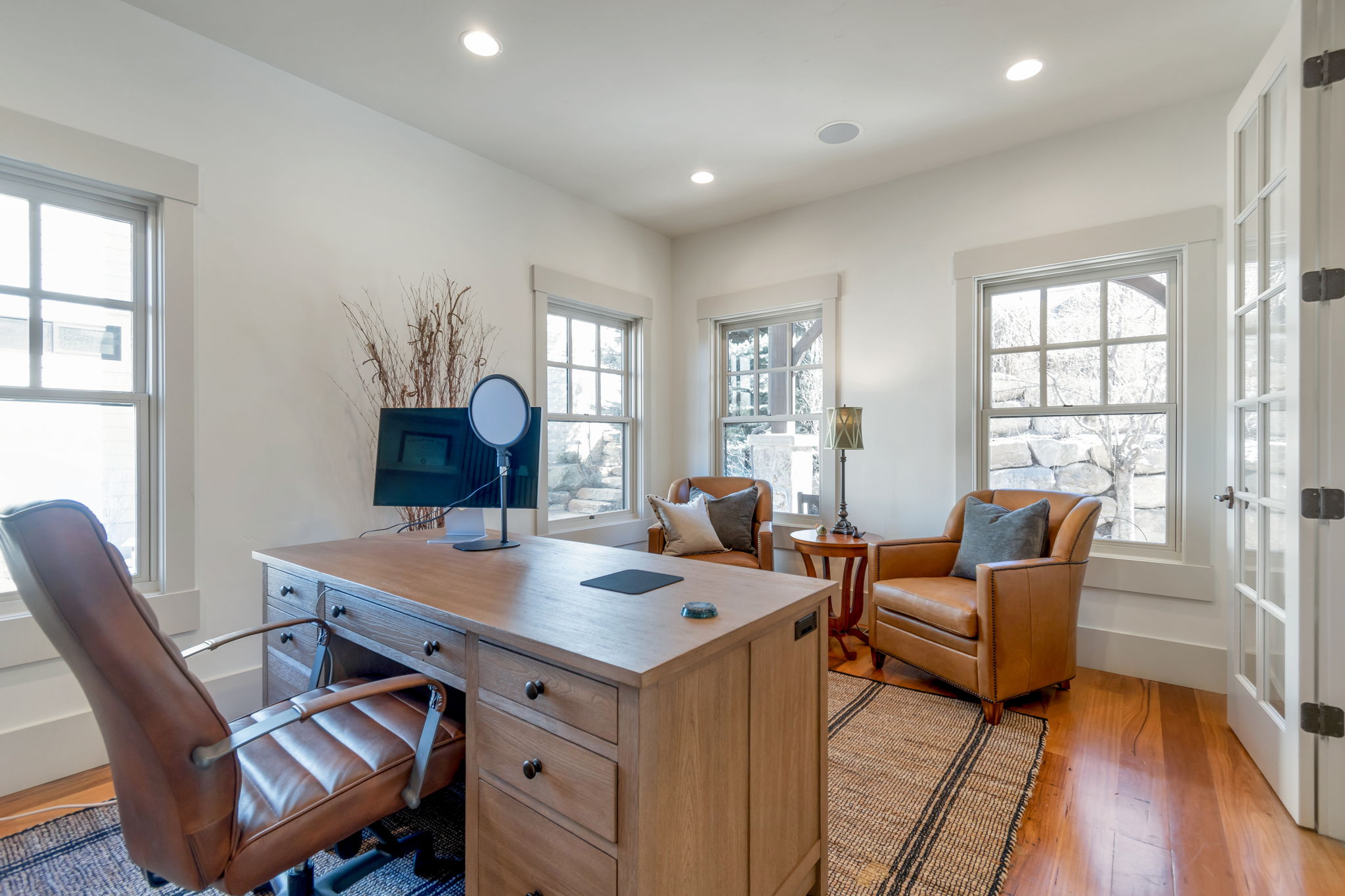 Home office featuring light wood-style floors and recessed lighting