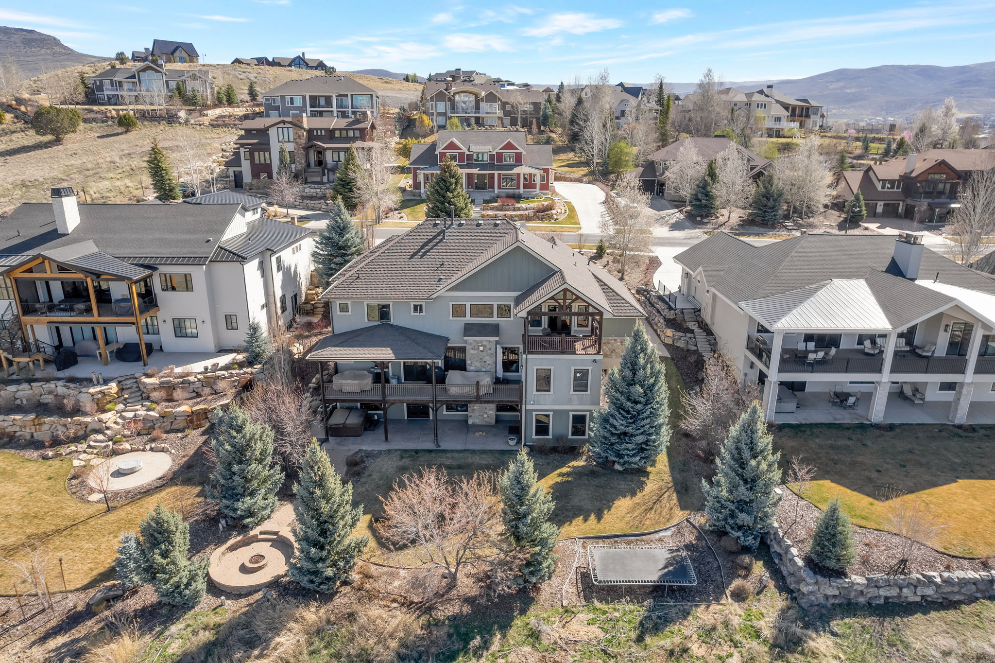 Aerial perspective of suburban area featuring a mountainous background