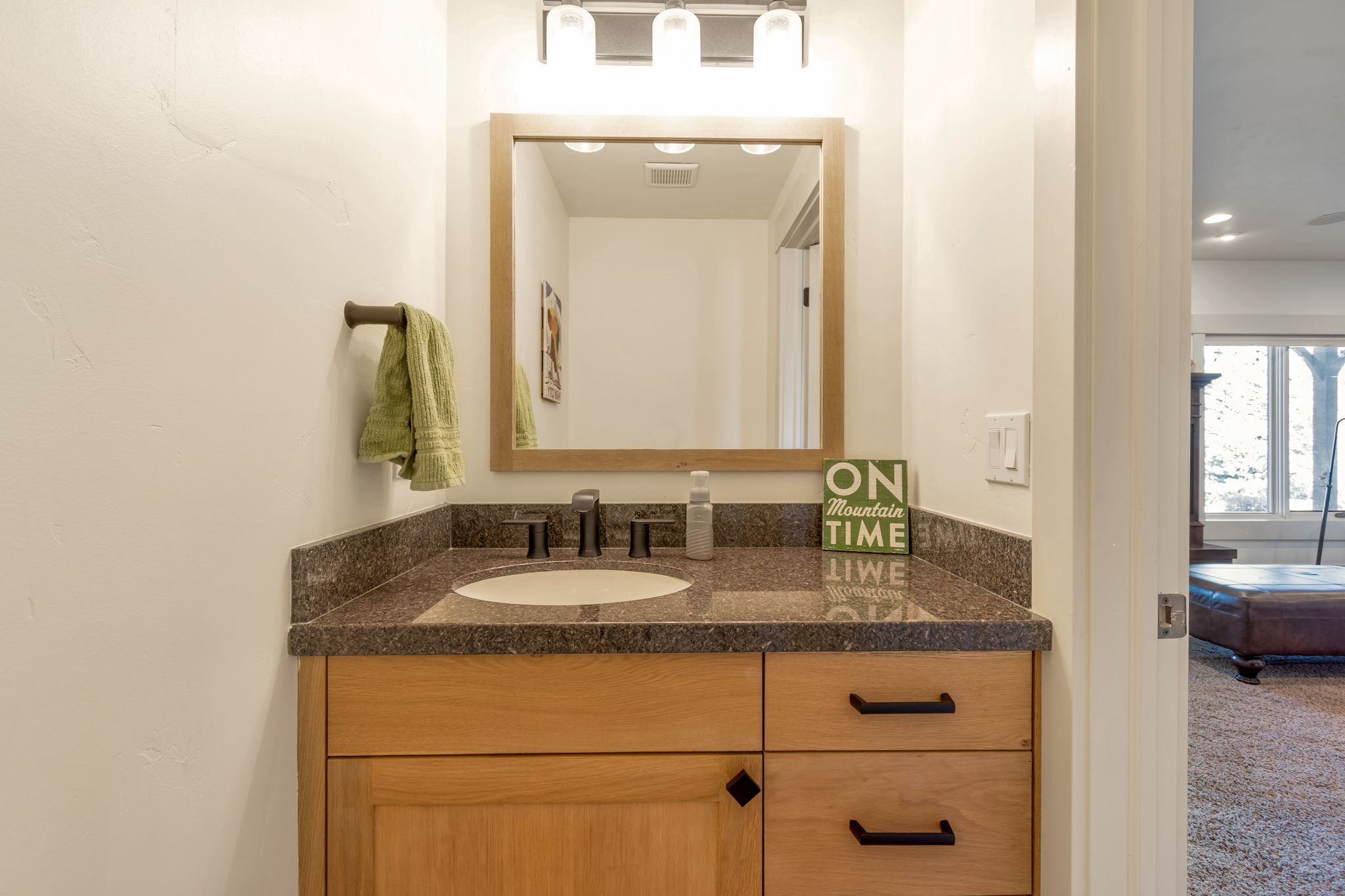 Bathroom with vanity and recessed lighting