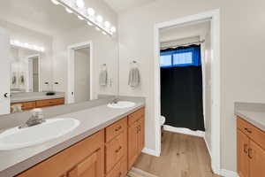 Full bathroom upstairs with double sinks and double vanity