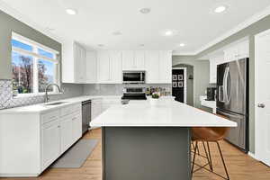 Updated kitchen counters, painted cabinets windows for lots of light