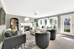 Family room with updated fireplace, mountain views, updated carpet and paint