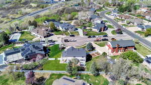 Aerial view of property's location featuring nearby suburban area