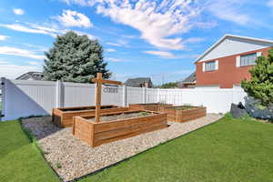 Four 8'x4' grow boxes were put in last spring, they are custom made with treated redwood (to withstand Utah winters