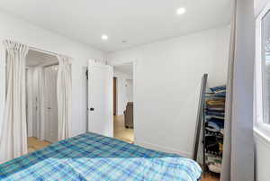 Bedroom with recessed lighting and light wood-style flooring