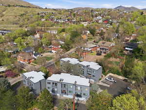 Aerial perspective of suburban area with a mountainous background
