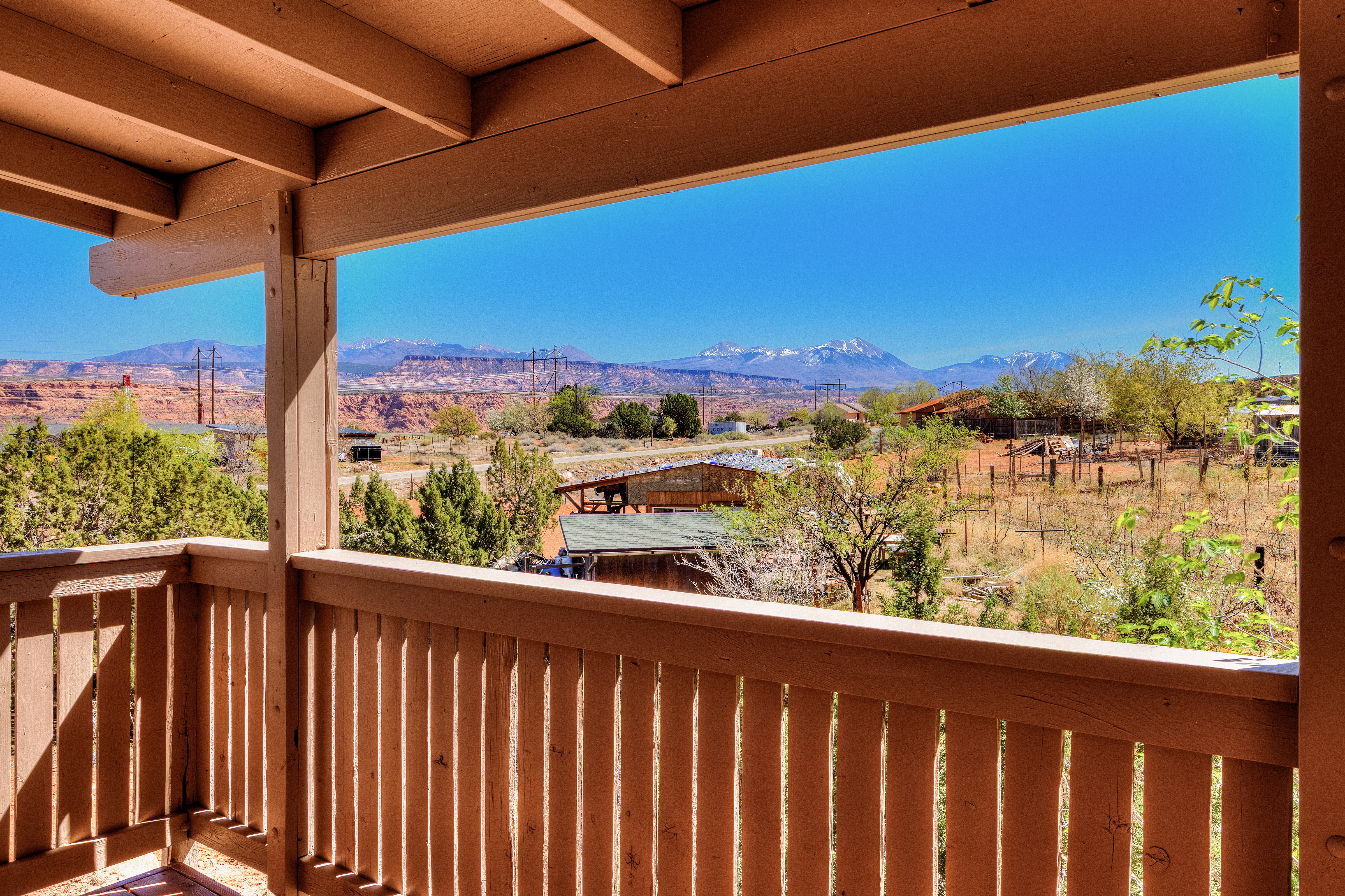 Covered back deck with mountain views.