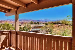 Covered back deck with mountain views.