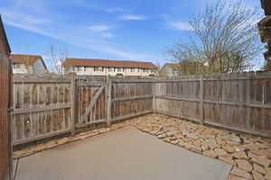 Fenced in Patio with Gate to Large Green Area