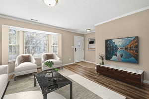 Living Room with Updated Flooring - this is Virtually staged to show possible layout for TV.