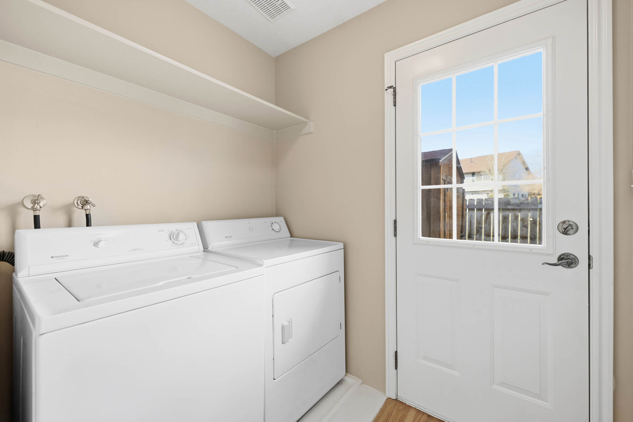 Laundry Area with Full Pantry Closet on Opposite Wall