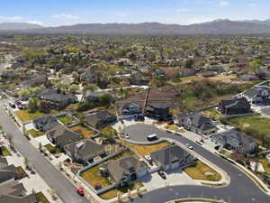 Aerial perspective of suburban area with a mountain backdrop