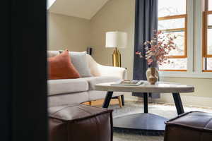 Living room featuring lofted ceiling