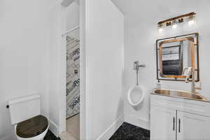 Full bath featuring vanity and a shower stall