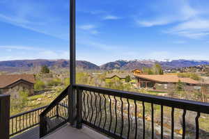 Balcony featuring a mountain view and a residential view