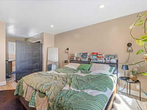 Bedroom featuring light wood-style floors and recessed lighting