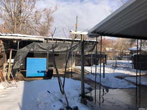 View of yard covered in snow