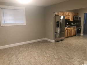 Kitchen featuring stainless steel appliances and wood finish cabinetry