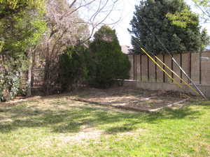 View of fenced backyard
