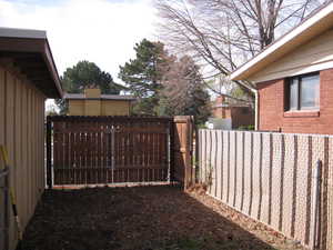 View of yard featuring a gate