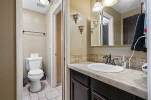 Bathroom with vanity and light tile patterned floors