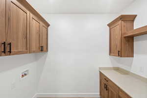 Laundry room featuring cabinet space and washer hookup