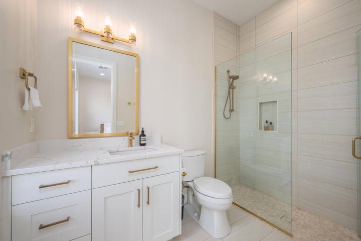 Bathroom with vanity and a stall shower