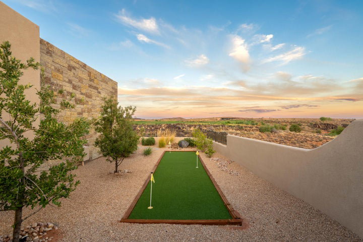 View of community featuring an area to practice putting
