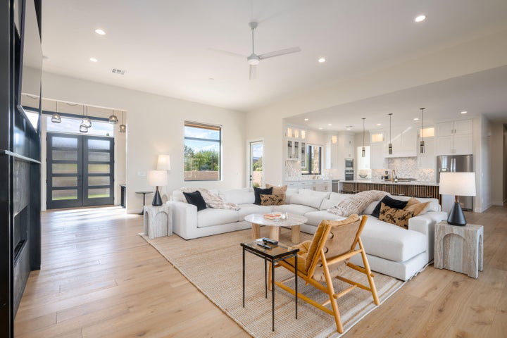 Living area featuring french doors, light wood finished floors, recessed lighting, and ceiling fan