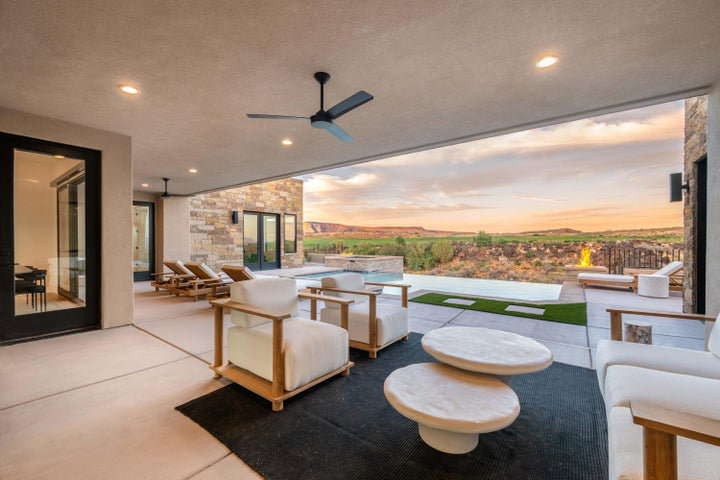 View of patio / terrace featuring a ceiling fan, an outdoor hangout area, and an outdoor pool
