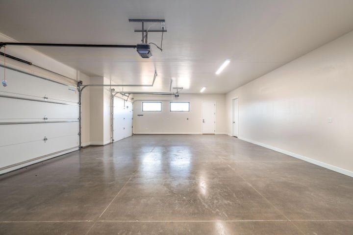 Garage featuring baseboards