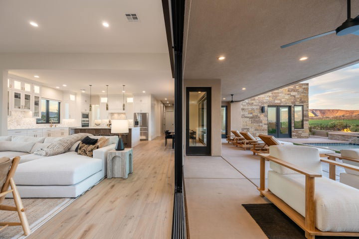 Living room with recessed lighting, french doors, and light wood finished floors