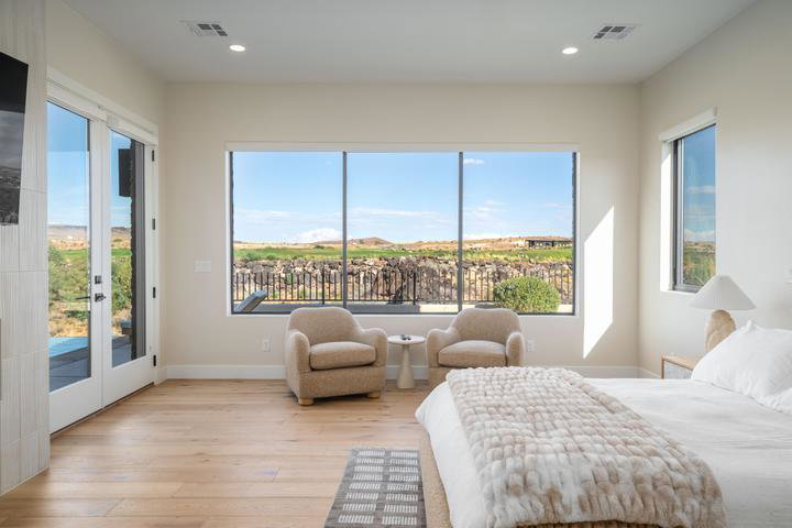 Bedroom with light wood-style floors, access to outside, recessed lighting, and french doors
