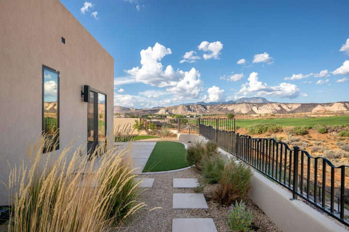Fenced backyard featuring a mountain view
