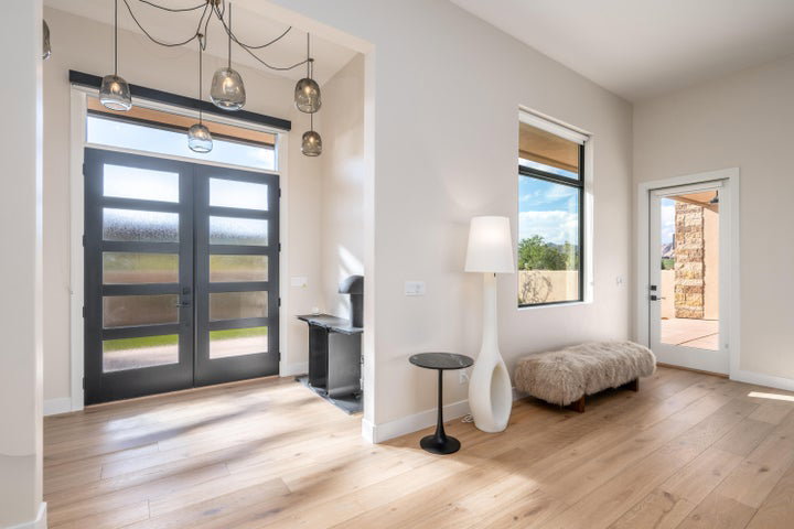 Entrance foyer with french doors and light wood-type flooring