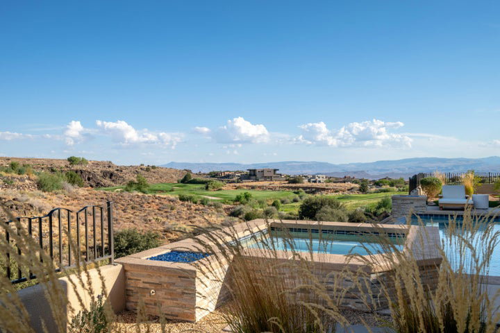 Swimming pool featuring a fire pit, a mountain view, and a patio