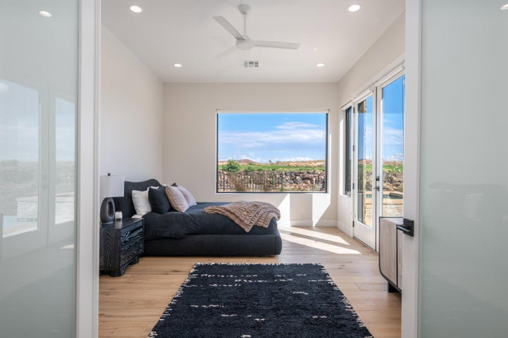 Living area with ceiling fan, light wood-style floors, and recessed lighting