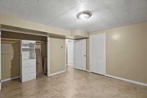 Unfurnished bedroom featuring multiple closets