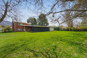 Back of house with brick siding