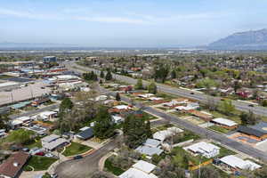 Aerial perspective of suburban area with a mountainous background