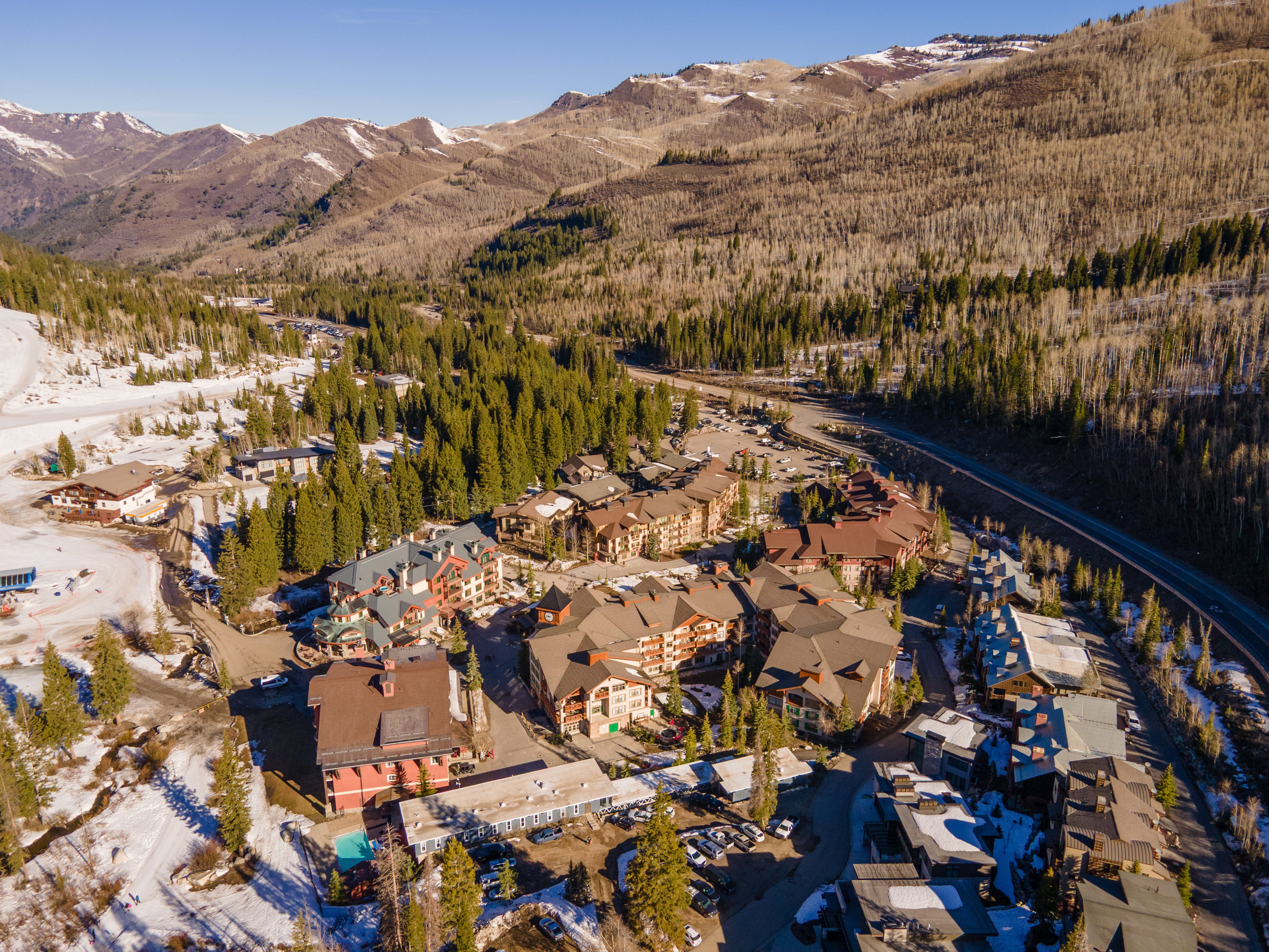 View of property location featuring mountains and a forest