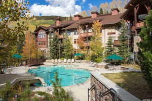 Community pool featuring a patio