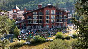 View of building exterior with a wooded view