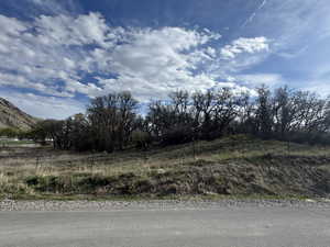 View of asphalt road with a rural view and a mountain view