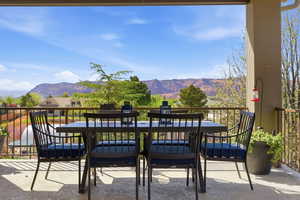 Patio / terrace featuring a mountain view and outdoor dining space